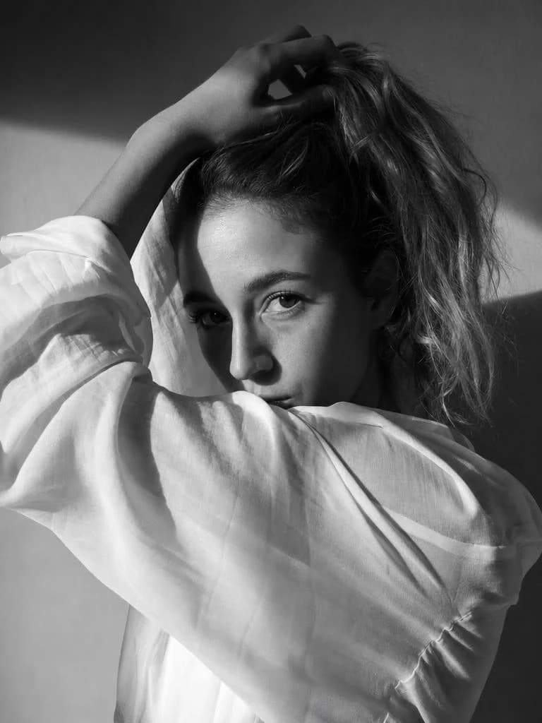 Editorial Monochrome - Raised Arm Portrait – AI photo prompt example